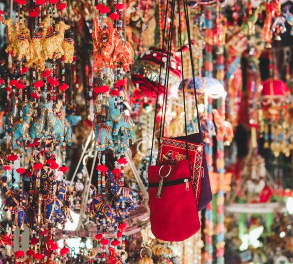 photo of red crossbody bag hanging beside ornaments