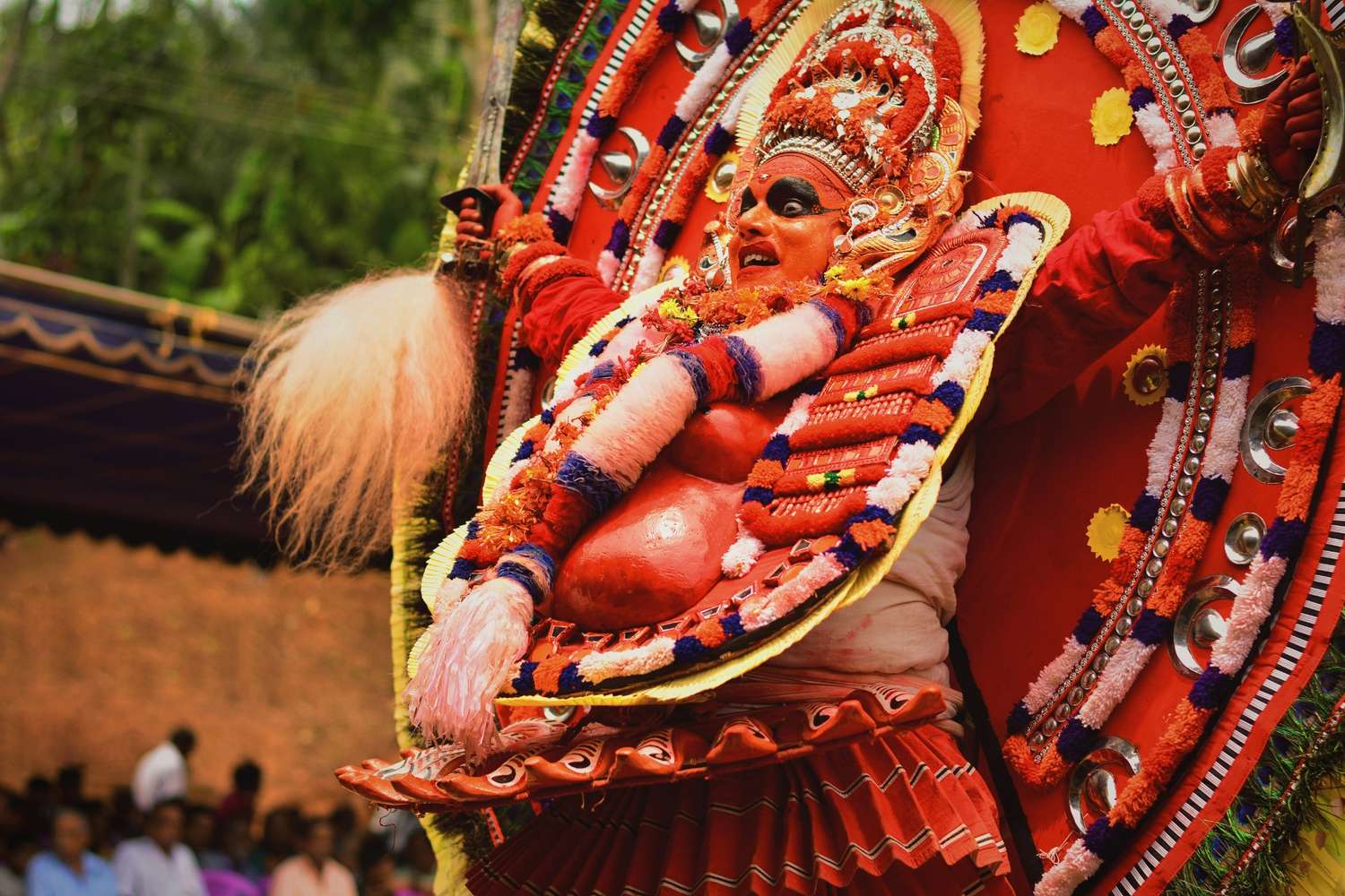 person wearing red costume -tribal and folk dances of India