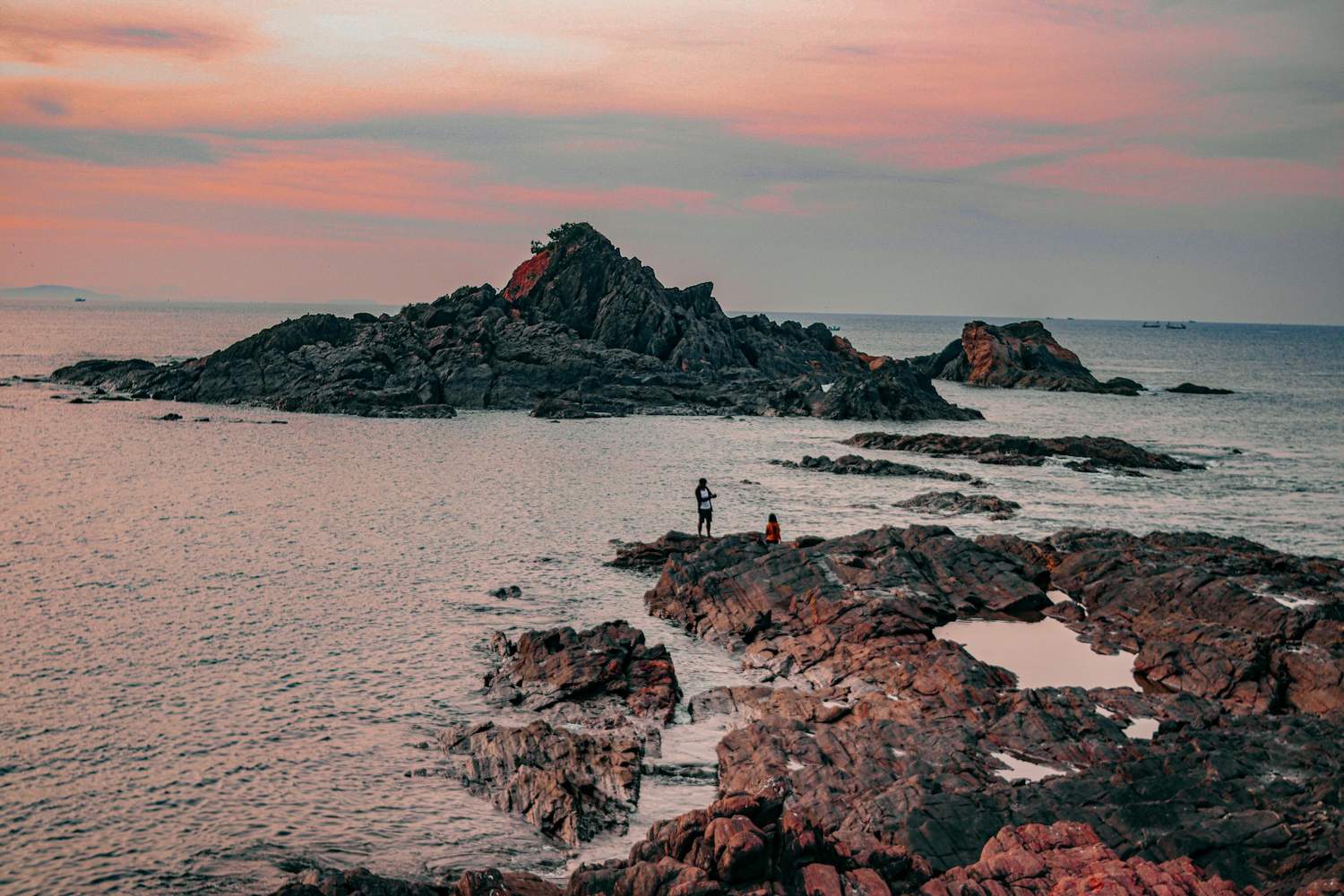 a person standing on coast of beach in gokarna